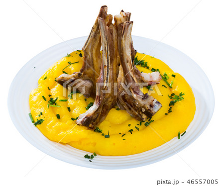 Tasty pinnekjott, lamb rib with mashed potato and greens, served at plate 46557005