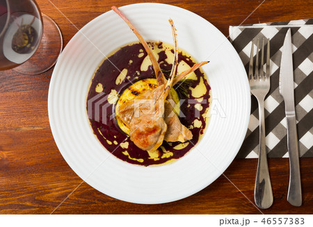 Lamb ribs with aubergine and wine sauce Lamb ribs with aubergine and wine sauce 46557383