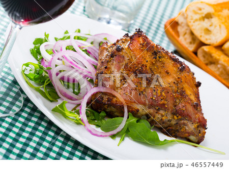 Roasted pork rack of ribs with greens 46557449