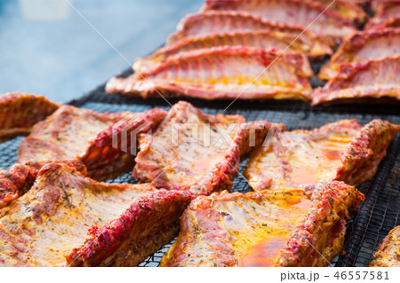 Meat ribs of pig roasting on barbecue 46557581