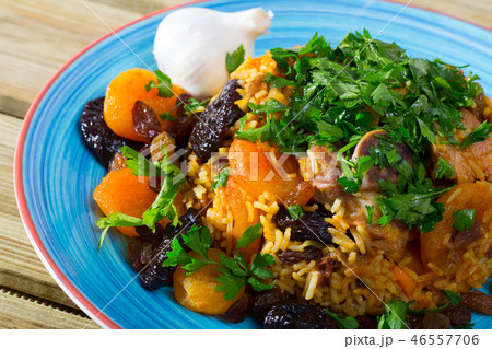 Lamb pilau with dried fruits and greens Lamb pilau with dried fruits and greens 46557706