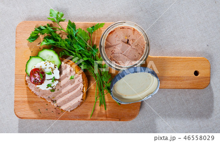 Top view of toast with pate, fresh cheese on wooden board Top view of toast with pate, fresh cheese on wooden board 46558029