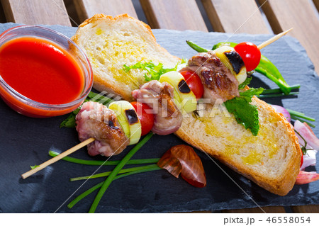 Shish kebab from mutton with tomato sauce 46558054