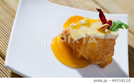 Croissant with camembert and honey 46558110