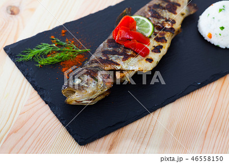 Baked trout with rice, grilled bell pepper 46558150