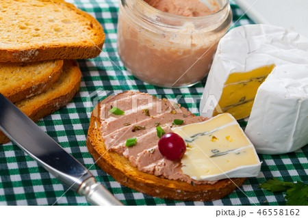 Pate on toasted bread with soft blue cheese Pate on toasted bread with soft blue cheese 46558162