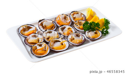 Fresh bivalve mussels with lemon Fresh bivalve mussels with lemon 46558345