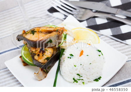 Baked trout steaks with rice 46558350
