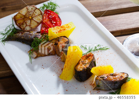 Appetizing baked trout steaks 46558355