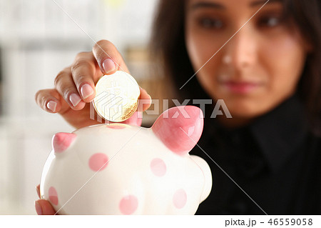 A young smiling chinese woman holding A young smiling chinese woman holding 46559058