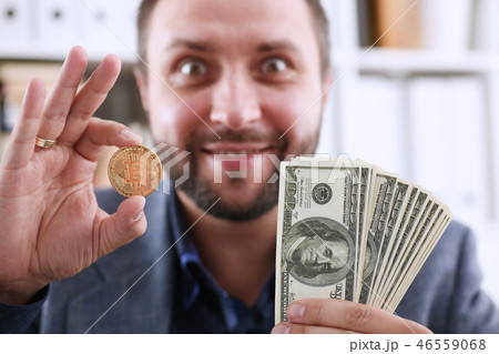 Young happy smiling businessman  holding 46559068