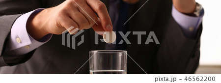 Adult male businessman hold tablet on Adult male businessman hold tablet on 46562200