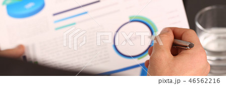 Male hand in suit hold siver pen in office 46562216