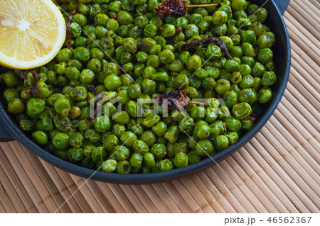 Green peas with chili pepper. Indian dish. 46562367