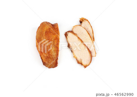 A close up of grilled, sliced chicken breast isolated on white background . A close up of grilled, sliced chicken breast isolated on white background . 46562990