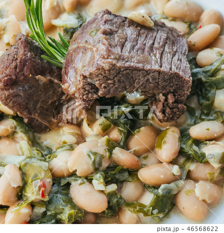 beef stew in sauce with beans and rosemary 46568622