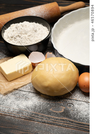 unrolled and unbaked Shortcrust pastry dough recipe on wooden background 46570894