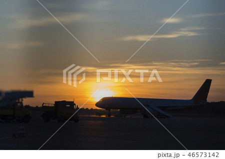 Colorful of sunset in the airport with aeroplane Colorful of sunset in the airport with aeroplane 46573142