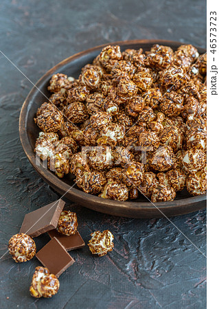 Dish with chocolate caramel popcorn. Dish with chocolate caramel popcorn. 46573723