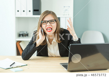 Stress, office, hysteric, people concept - aggressive woman with a lot of work in office Stress, office, hysteric, people concept - aggressive woman with a lot of work in office 46573772