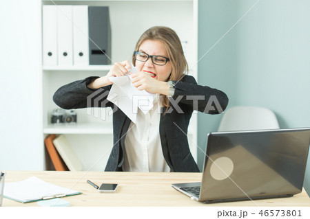 Stress, office, hysteric, people concept - aggressive woman with a lot of work in office Stress, office, hysteric, people concept - aggressive woman with a lot of work in office 46573801