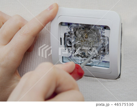 Repairing electric wall breaker, close-up. 46575530