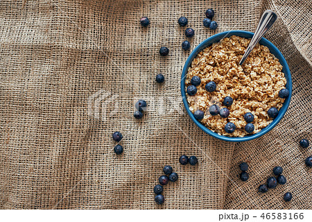 Top view of muesli bowl with blueberries. Diet breakfast in the morning. 46583166