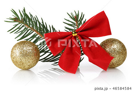 Red ribbon, golden spheres and spruce branches 46584584