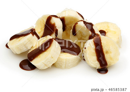 Banana slices topped with chocolate syrup Banana slices topped with chocolate syrup 46585387
