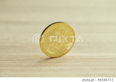 Golden Bitcoin coin on wood background Golden Bitcoin coin on wood background 46586713
