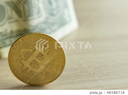 Golden Bitcoin coin on wood background Golden Bitcoin coin on wood background 46586716