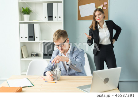 Business, emotions and people concept - Business woman shout at male worker in office place 46587291