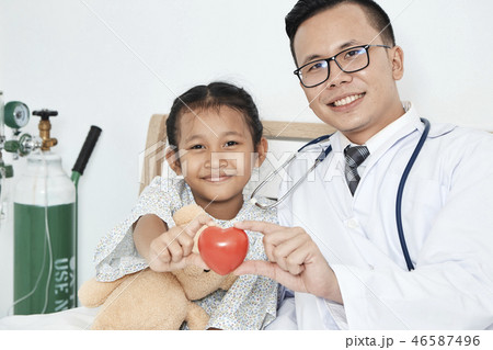 Young male doctor pediatrician checking girl 46587496