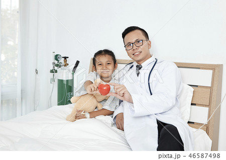 Young male doctor pediatrician checking girl 46587498