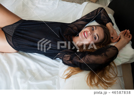 beautiful woman in underwear lies on the bed in the bedroom beautiful woman in underwear lies on the bed in the bedroom 46587838