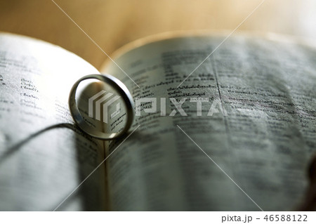 Silver ring on pages book 46588122