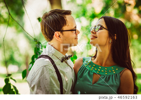 Beautiful young couple on the park background 46592163
