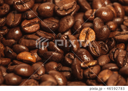 Dark many roasted coffee beans texture background 46592783