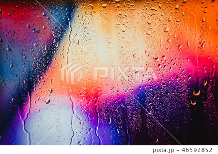 Raindrops on a blurred multicolored background Raindrops on a blurred multicolored background 46592852
