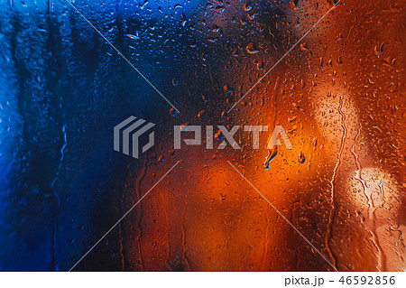 Drops of rain on the window of the car in evening Drops of rain on the window of the car in evening 46592856