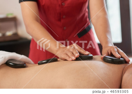 Hot stone massage therapy 46593305