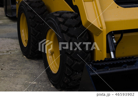Burmarrad, Malta, 15 december 2018 - small lifter Excavator in the machinery store - close up wheels 46593902