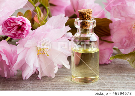 Essential oil bottle with kwanzan cherry blossoms 46594678