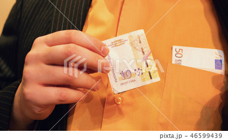 man holding ten Bulgarian levs fifty euros pocket 46599439