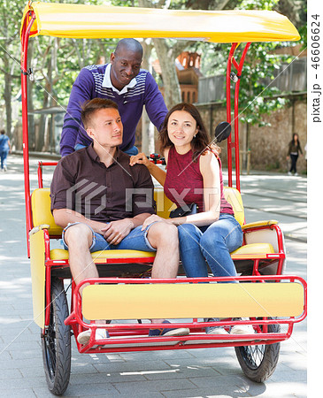 Couple riding on rickshaw 46606624