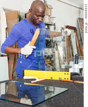 Glazier working in glass factory Glazier working in glass factory 46606635