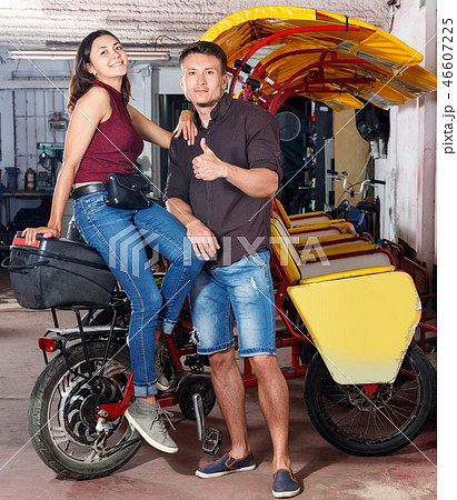 Cheerful girl with boyfriend wanting to hire touristic trishaw for urban trip 46607225
