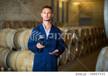 winery employee with wine sample in glass . 46607435