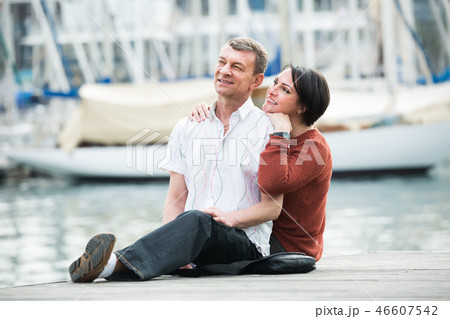Happy man and woman in love posing outdoors Happy man and woman in love posing outdoors 46607542