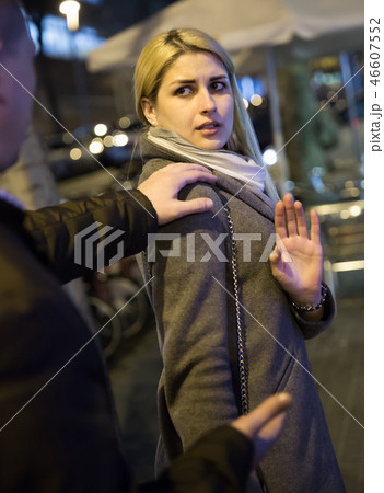 Danger adult man touch worried woman on the street Danger adult man touch worried woman on the street 46607552